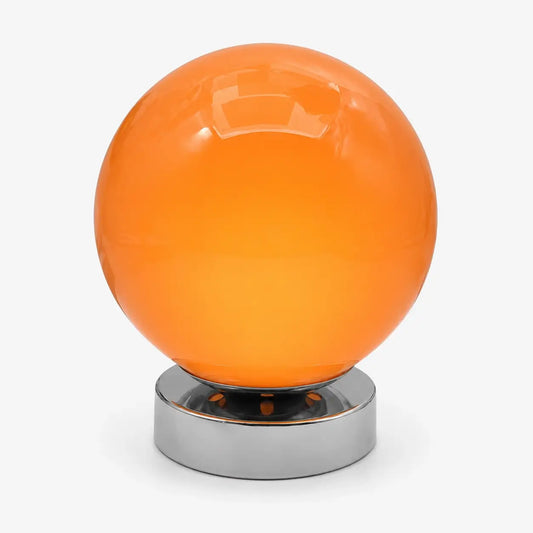 Lampe de bureau à globe en verre soufflé orange et base en métal chromé, modèle Ignis, sur fond clair